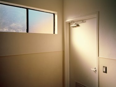 Palm Springs, California, bathroom, light, warm, orange, window, door, 6x7, film, color, kodak